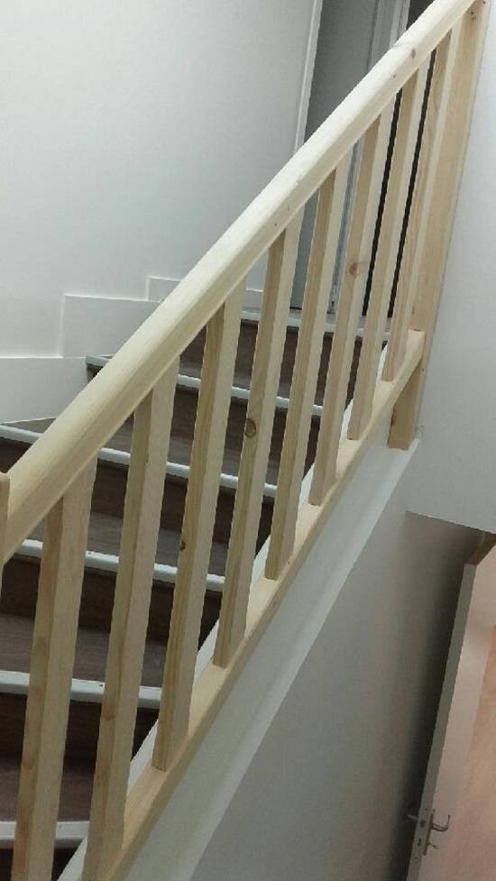 Remplacer la rampe d'un escalier bois par un artisan proche Manéglise 76