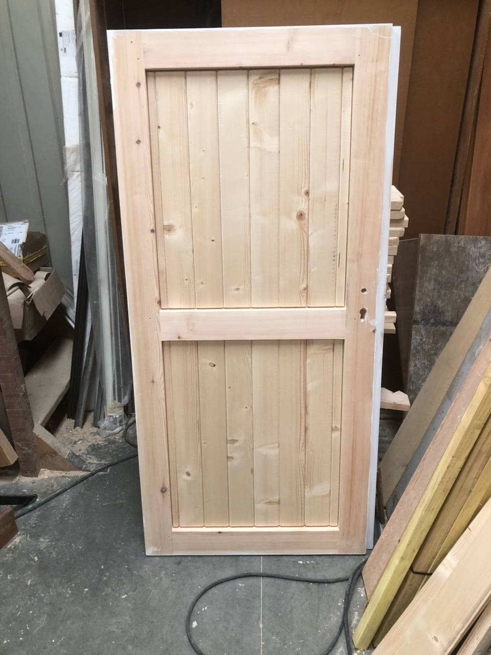 Fabriquer une porte bois sur mesure par un menuisier proche Le havre 76